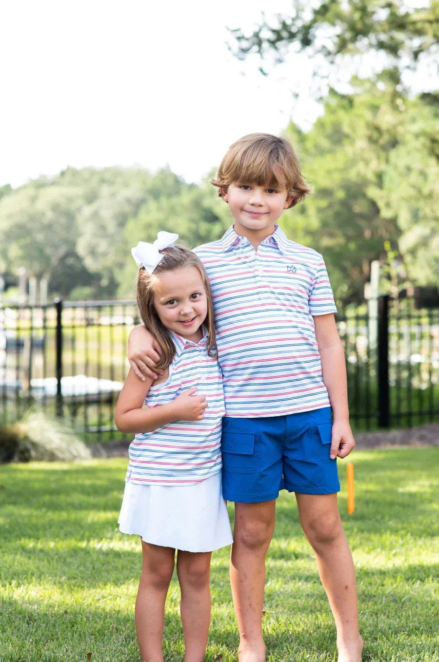 GIRLS SLEEVELESS PRO PERFORMANCE POLO - USA STRIPE